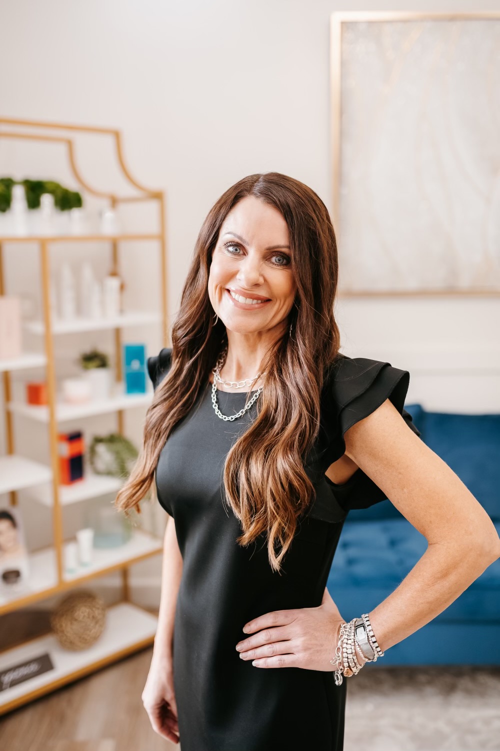 Ridgeline provider in a black dress standing in the clinic retail area