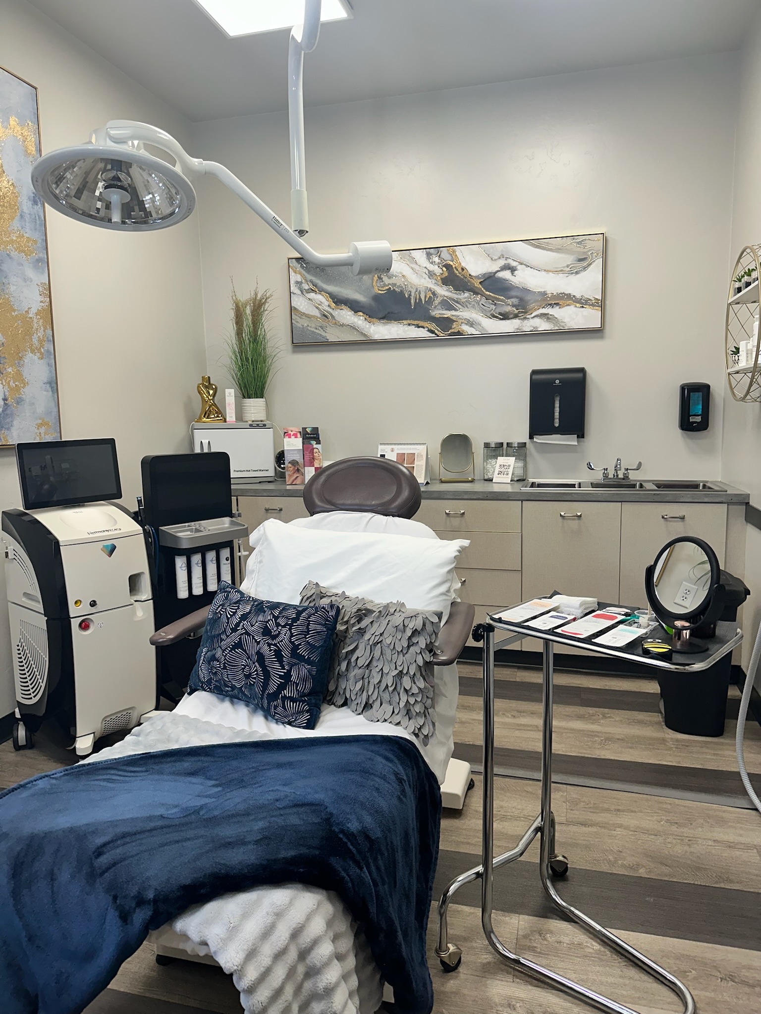 Treatment room with procedure chair and device at Ridgeline Longevity and Aesthetics