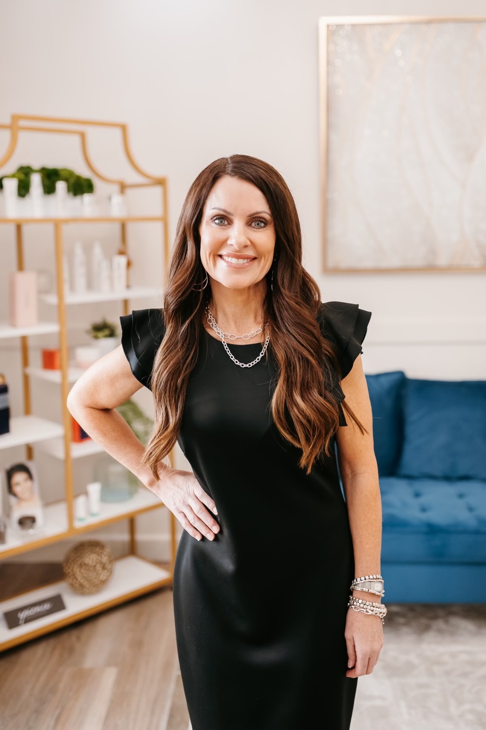 Ridgeline provider in a black dress smiling in the clinic retail area